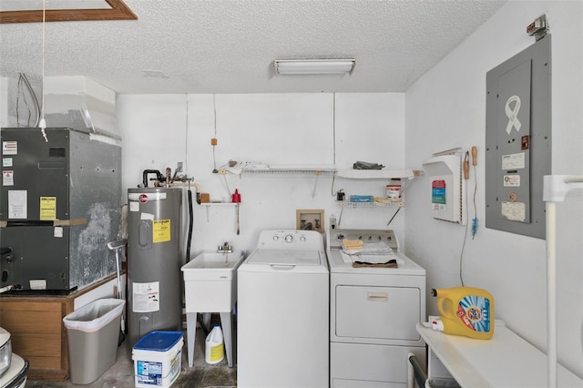 laundry area featuring laundry area, electric panel, separate washer and dryer, a textured ceiling, and electric water heater