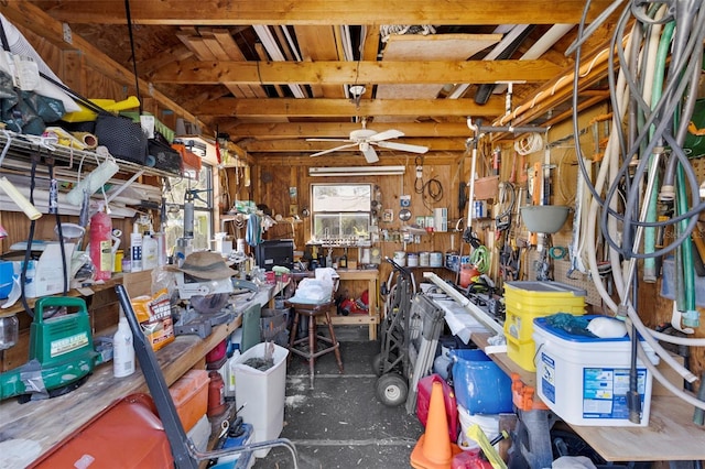 interior space featuring a workshop area and a ceiling fan