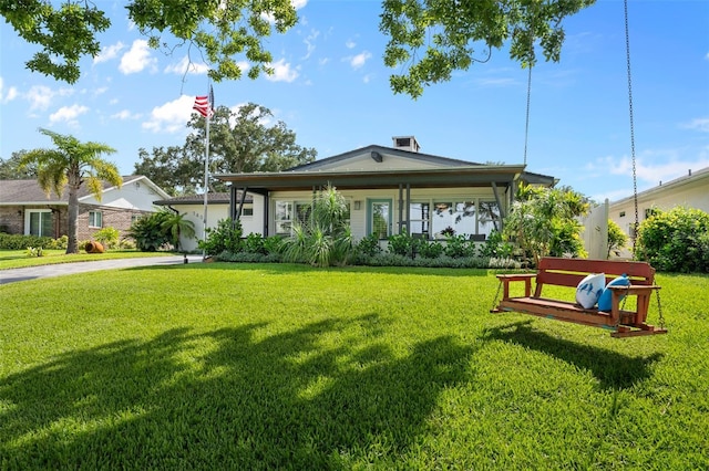 view of front of house featuring a front lawn and driveway