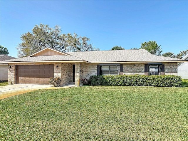 ranch-style home with a front yard, driveway, roof with shingles, a garage, and brick siding