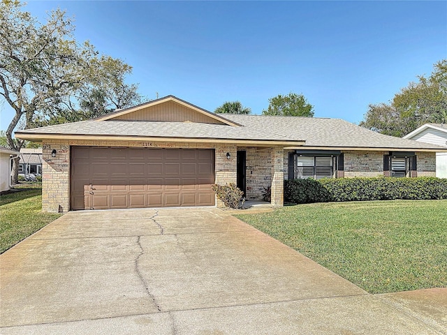 ranch-style home featuring a garage, concrete driveway, a front lawn, and a shingled roof