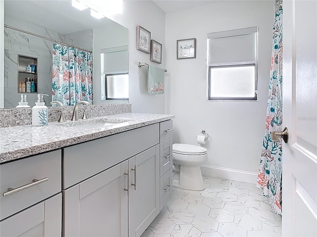 full bathroom featuring marble finish floor, toilet, vanity, and baseboards