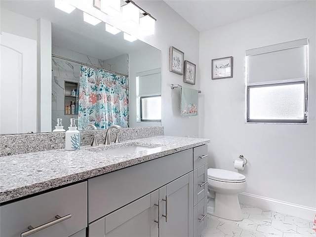 bathroom featuring vanity, a shower with shower curtain, baseboards, toilet, and marble finish floor