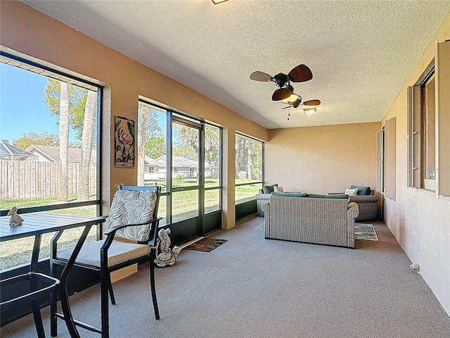 sunroom / solarium with ceiling fan