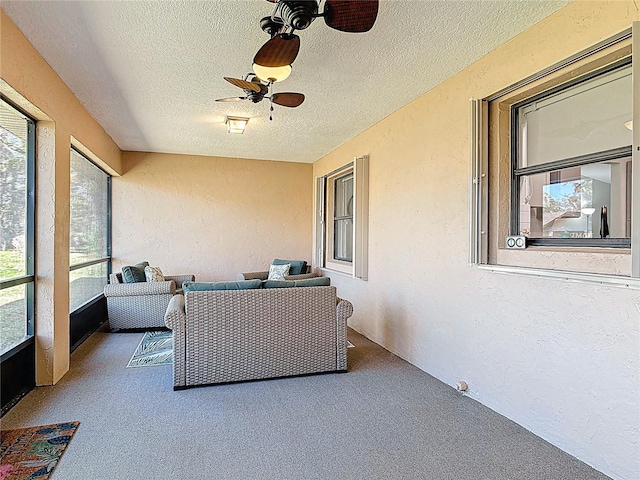 sunroom / solarium with ceiling fan