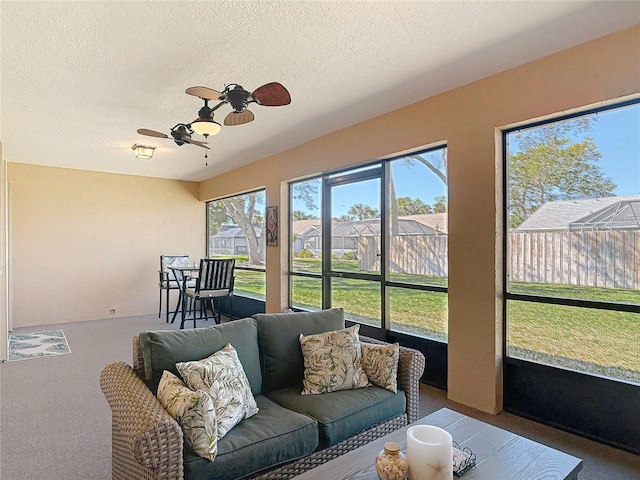 sunroom with a ceiling fan