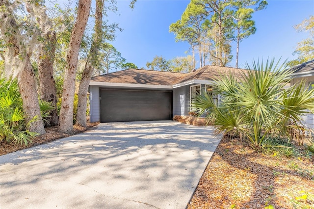 view of front of home with driveway and an attached garage