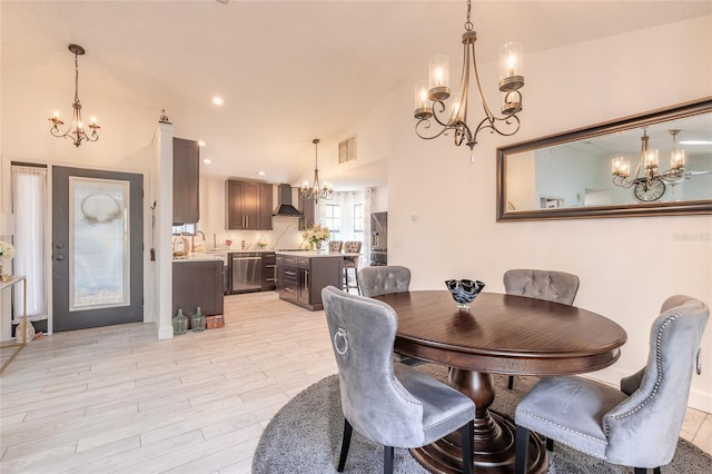 dining area with light wood finished floors, visible vents, vaulted ceiling, recessed lighting, and a notable chandelier