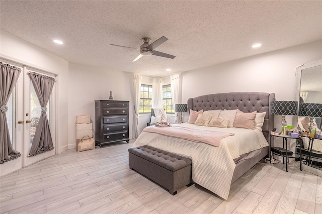 bedroom with ceiling fan, a textured ceiling, light wood-style floors, and access to outside