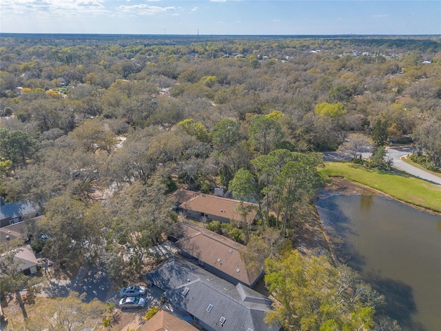 bird's eye view with a water view and a wooded view