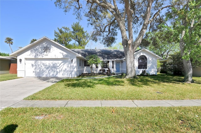 single story home with driveway, a front lawn, and a garage