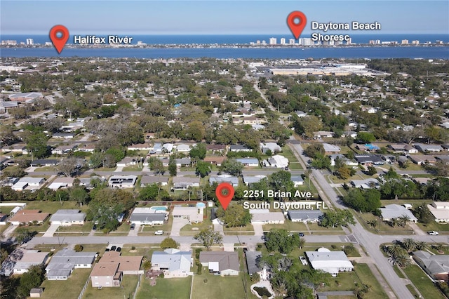 birds eye view of property featuring a water view and a residential view