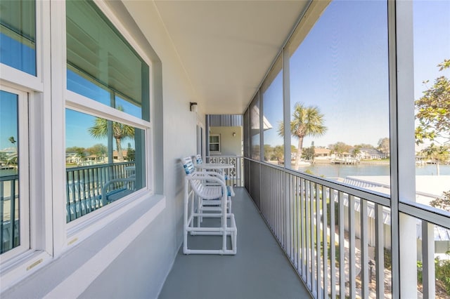 balcony featuring a water view