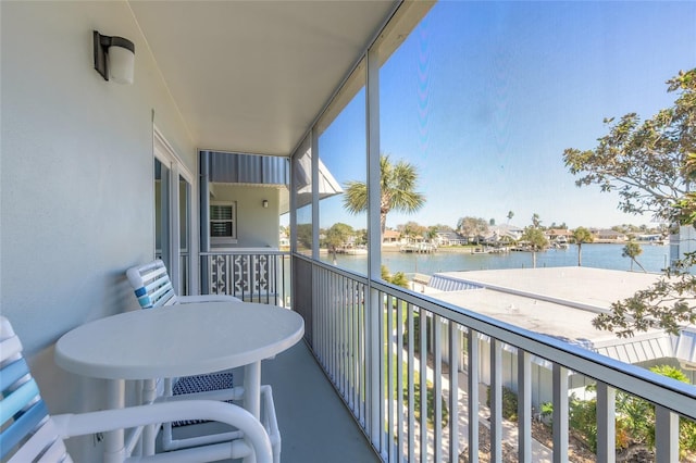 balcony featuring a water view