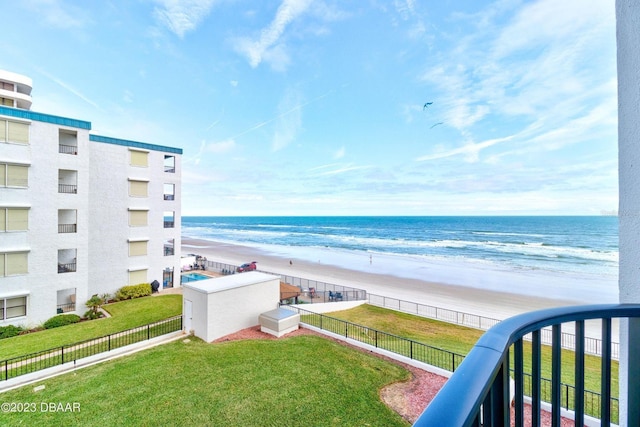 water view featuring a beach view and fence