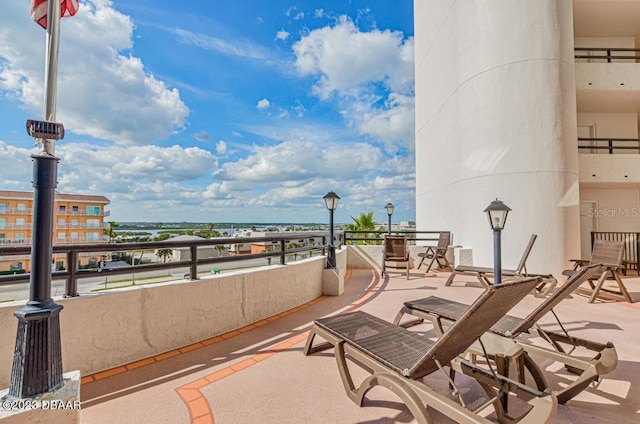 view of patio featuring a balcony