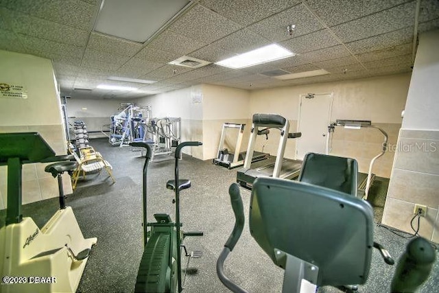 workout area with a paneled ceiling and visible vents