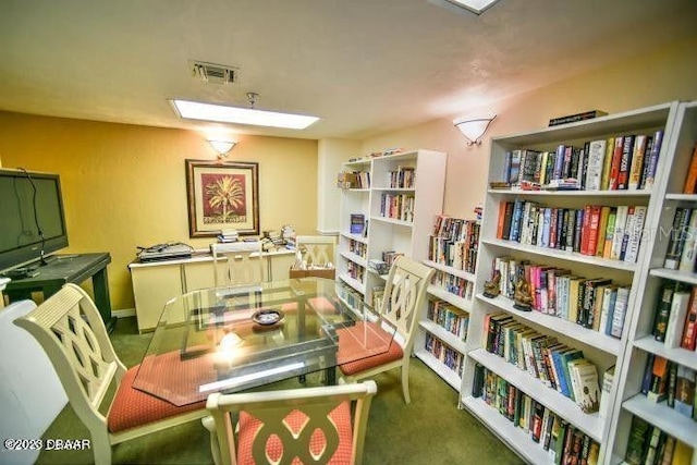 sitting room featuring visible vents and carpet floors