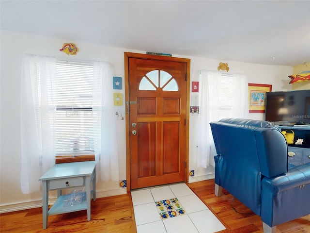 entryway with light wood finished floors