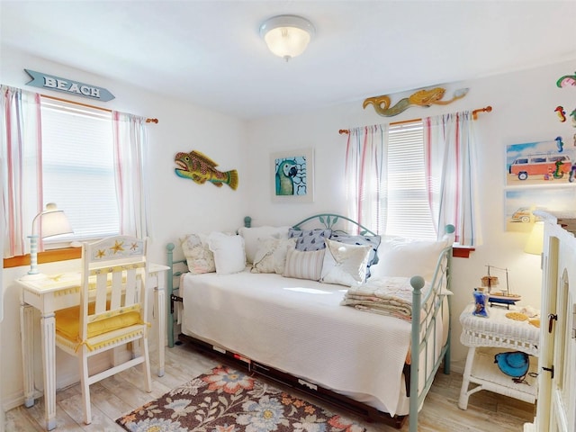 bedroom with light wood-style flooring