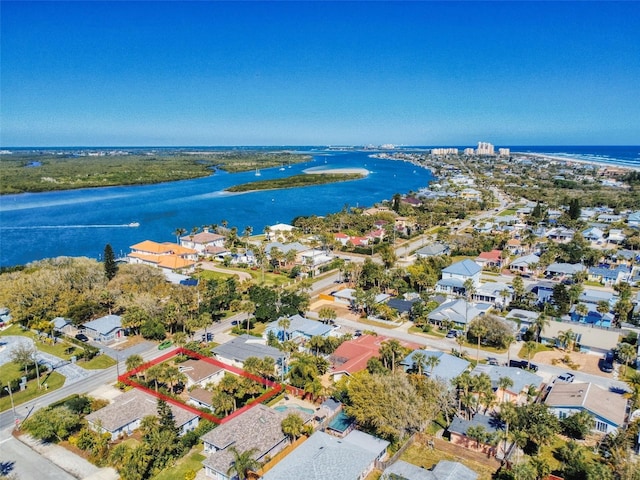 bird's eye view featuring a residential view and a water view