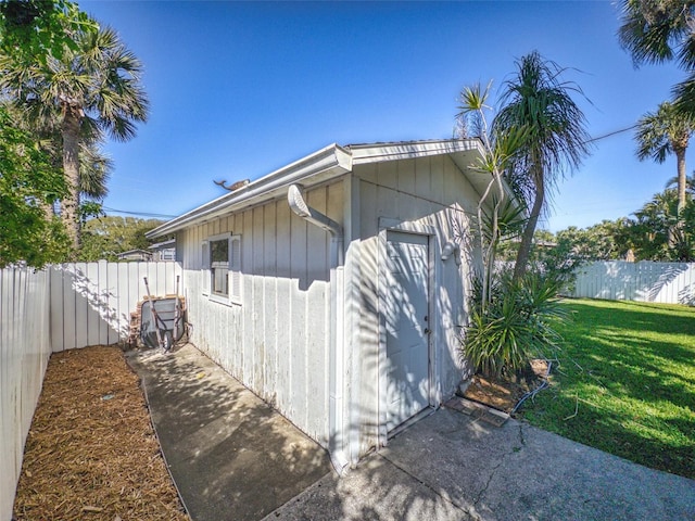 view of property exterior featuring a yard and a fenced backyard