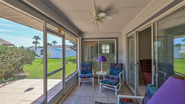 sunroom with a ceiling fan