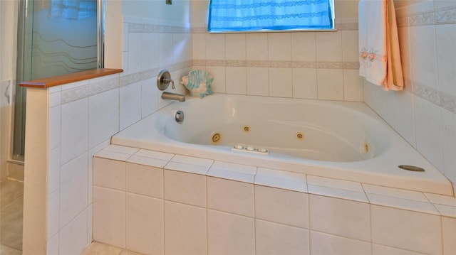 full bathroom with a whirlpool tub