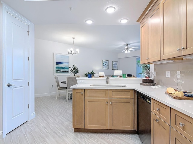 kitchen featuring light countertops, dishwashing machine, ceiling fan with notable chandelier, a peninsula, and a sink