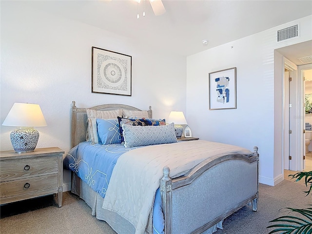 carpeted bedroom with visible vents, ceiling fan, and baseboards