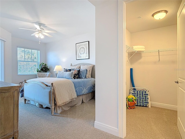 carpeted bedroom featuring baseboards