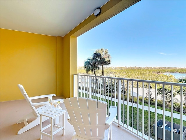 balcony featuring a water view