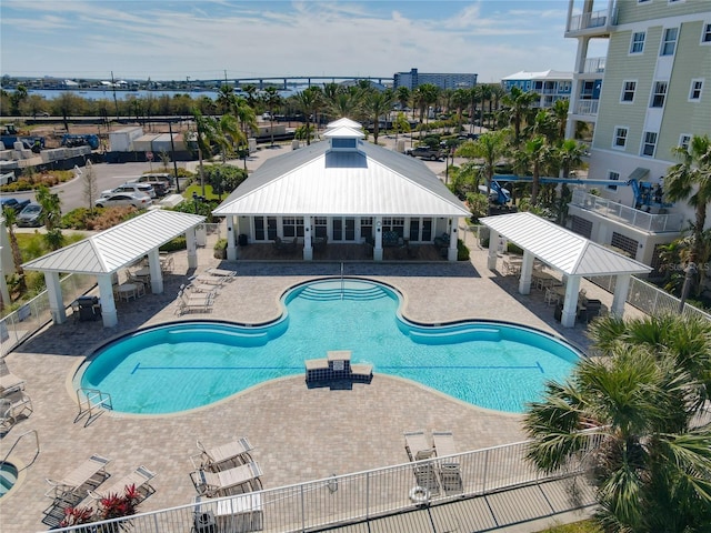 community pool featuring a gazebo, a patio, and fence