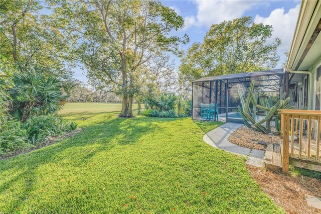 550 Bottlebrush Ct, New Smyrna Beach, FL 32168 - view of green lawn featuring a lanai