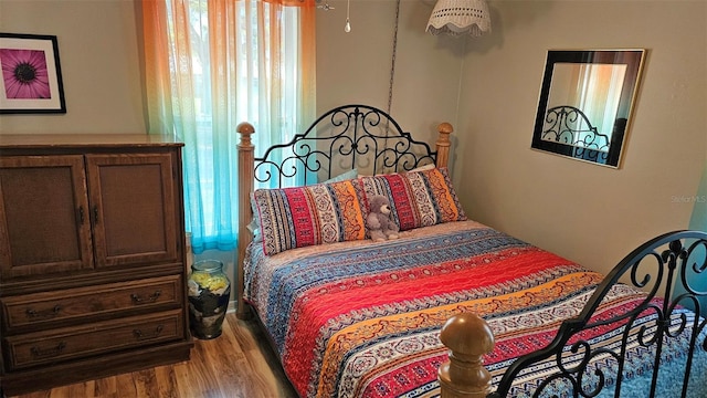 919 Fairvilla Dr, New Smyrna Beach, FL 32168 - bedroom featuring wood finished floors