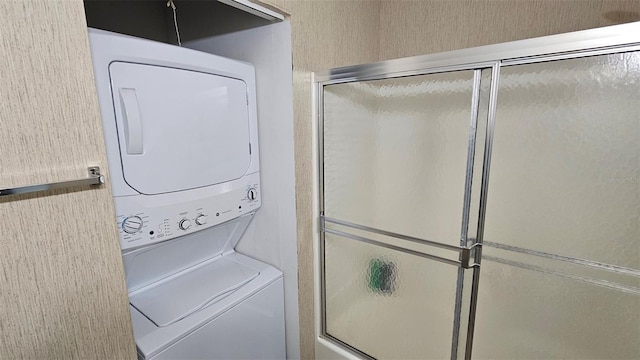 919 Fairvilla Dr, New Smyrna Beach, FL 32168 - laundry area with laundry area and stacked washing maching and dryer
