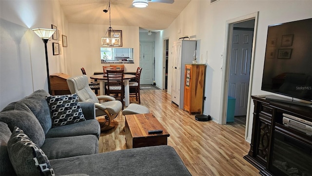 919 Fairvilla Dr, New Smyrna Beach, FL 32168 - living room featuring light wood-style flooring, a ceiling fan, and baseboards