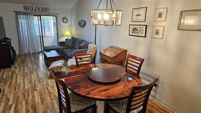 919 Fairvilla Dr, New Smyrna Beach, FL 32168 - dining space featuring wood finished floors and baseboards