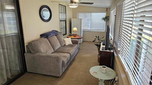 919 Fairvilla Dr, New Smyrna Beach, FL 32168 - living room featuring lofted ceiling, carpet, and ceiling fan