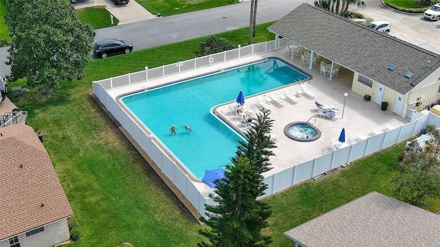 919 Fairvilla Dr, New Smyrna Beach, FL 32168 - community pool featuring a fenced backyard, a lawn, and a patio
