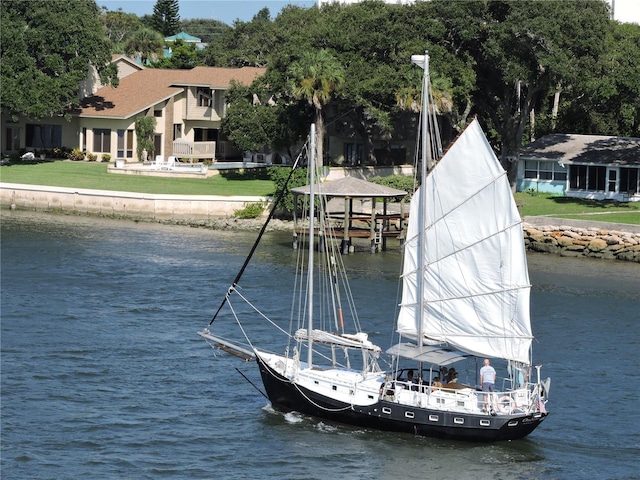 919 Fairvilla Dr, New Smyrna Beach, FL 32168 - dock area with a yard and a water view