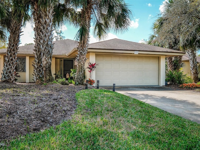168 Turnberry Cir, New Smyrna Beach, FL 32168 - ranch-style house featuring concrete driveway, an attached garage, and stucco siding