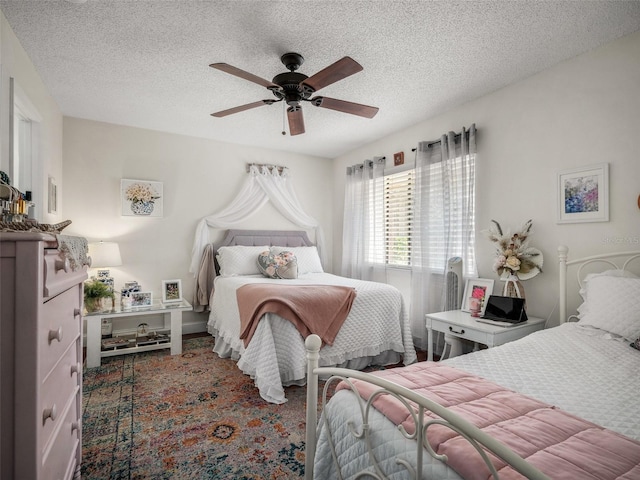 168 Turnberry Cir, New Smyrna Beach, FL 32168 - bedroom with a ceiling fan and a textured ceiling