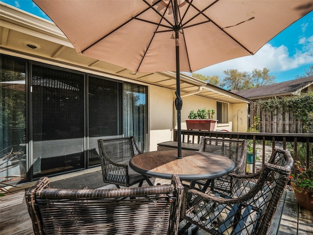 168 Turnberry Cir, New Smyrna Beach, FL 32168 - wooden deck featuring outdoor dining space and fence