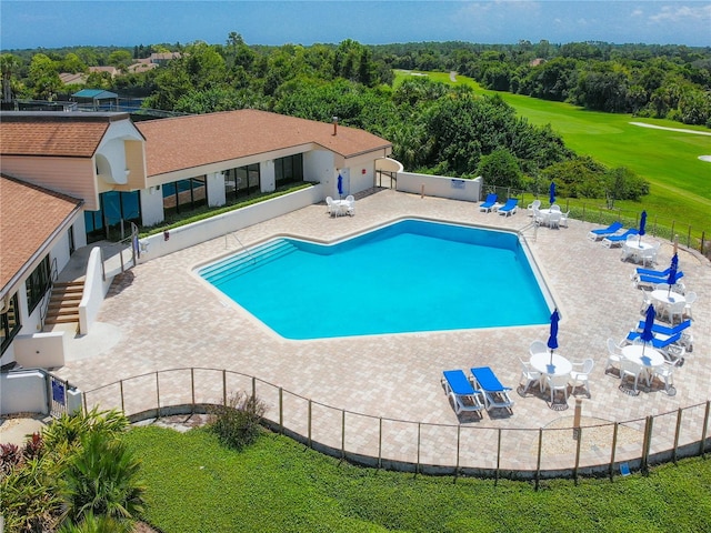 168 Turnberry Cir, New Smyrna Beach, FL 32168 - community pool featuring a patio area, a yard, and fence