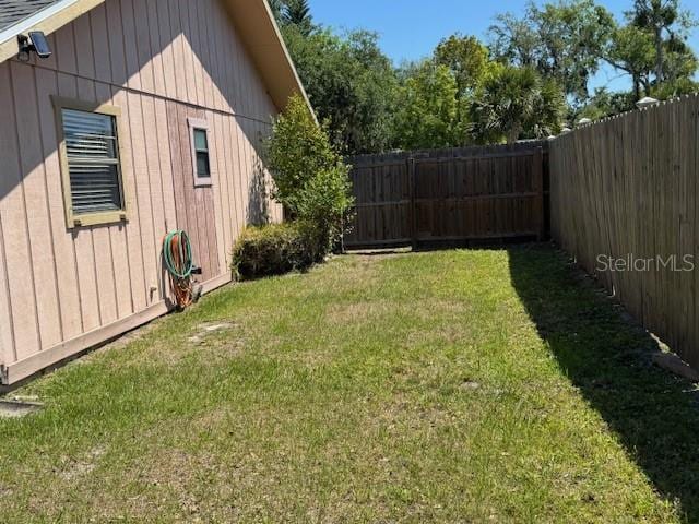 view of yard with a fenced backyard