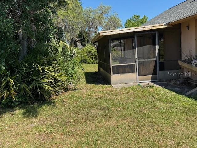 view of yard featuring a sunroom