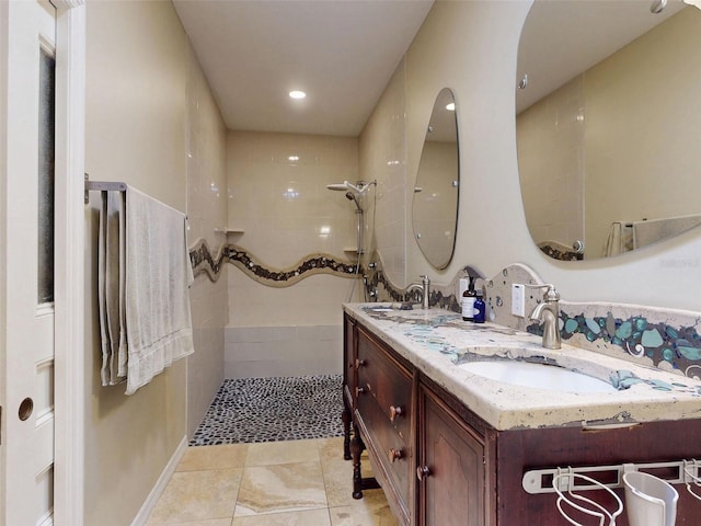 536 Faulkner St, New Smyrna Beach, FL 32168 - full bath featuring double vanity, a sink, tile patterned flooring, and a walk in shower
