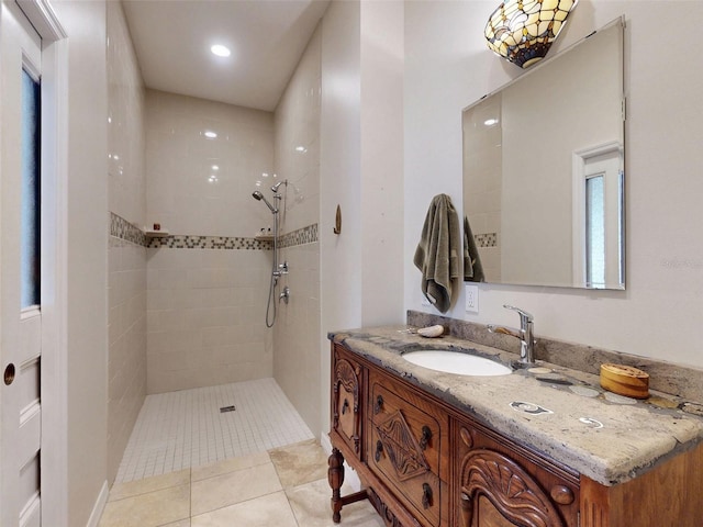 536 Faulkner St, New Smyrna Beach, FL 32168 - bathroom with tile patterned floors, vanity, and a tile shower