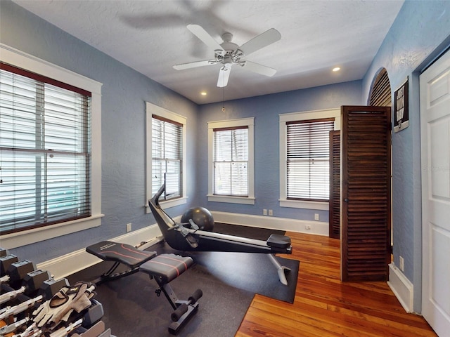 536 Faulkner St, New Smyrna Beach, FL 32168 - exercise room featuring recessed lighting, a textured wall, baseboards, a ceiling fan, and wood finished floors